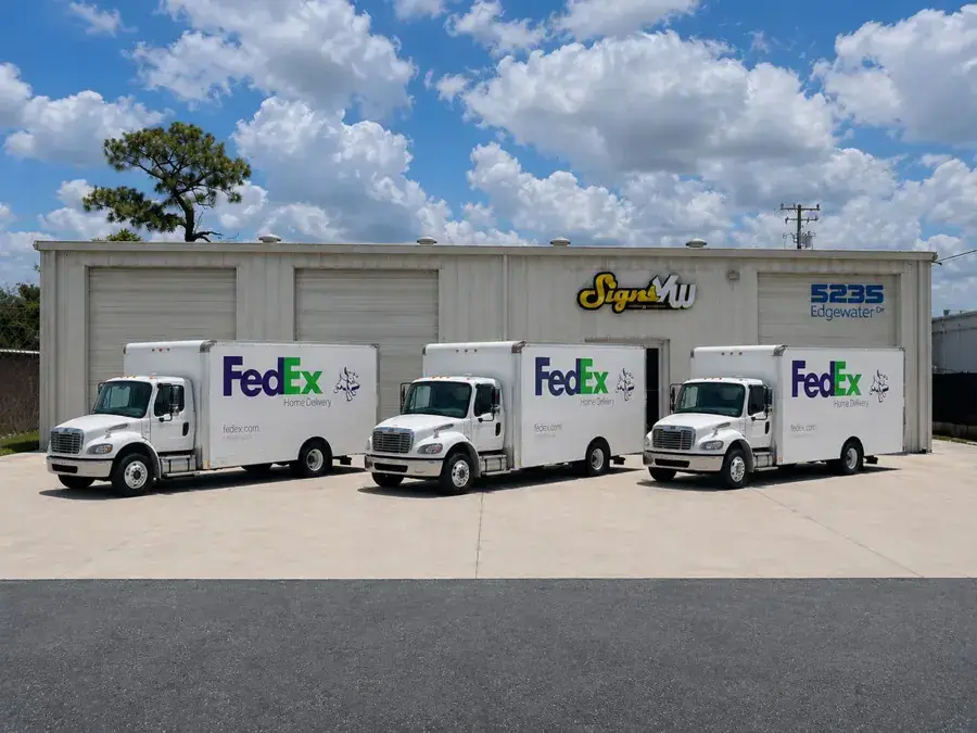 FedEx fleet of three wrapped trucks