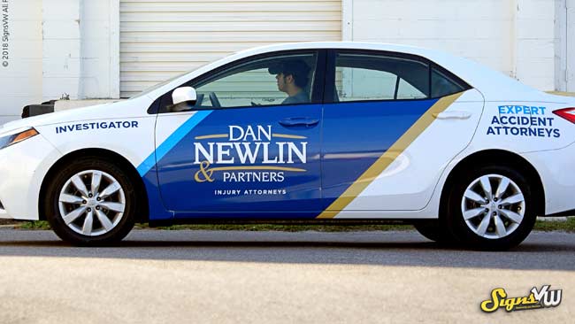 Sedan covered with Attorney Dan Newlin Advertising