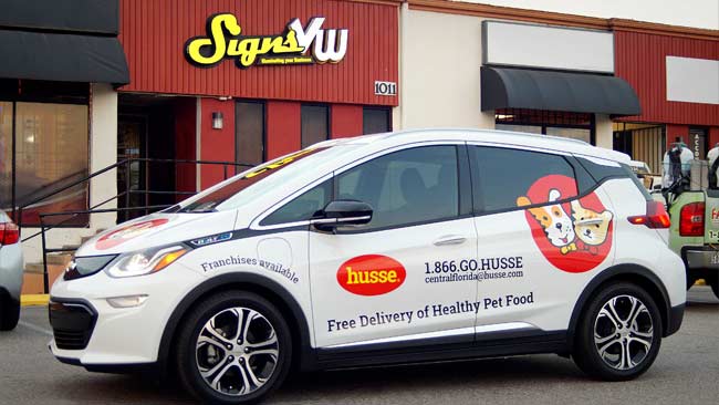 Vehicle wrapped with Husse Pet Food advertising
