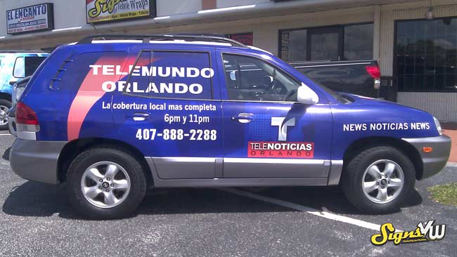 SUV fully wrapped in Telemundo Orlando advertising 