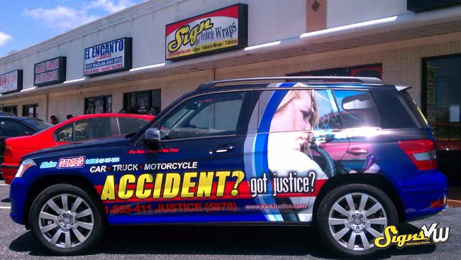 Picture of an SUV wrapped with the Got Justice Accident attorney advertising