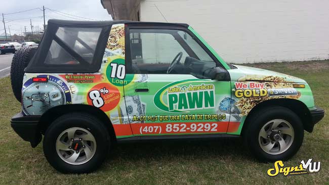 Jeep in the foreground of the photo with a full wrap for Latin American Pawn