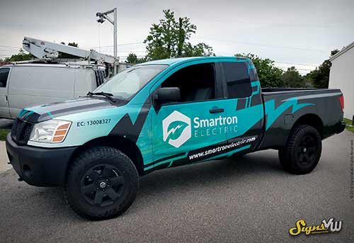 Picture of a pickup truck wrapped with the smartron electric company advertising