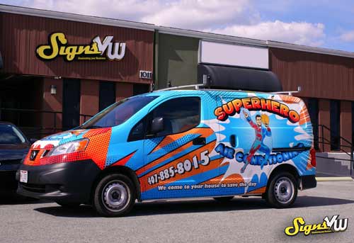 Van in front of the signs vw shop with a Superhero Vehicle Wrap